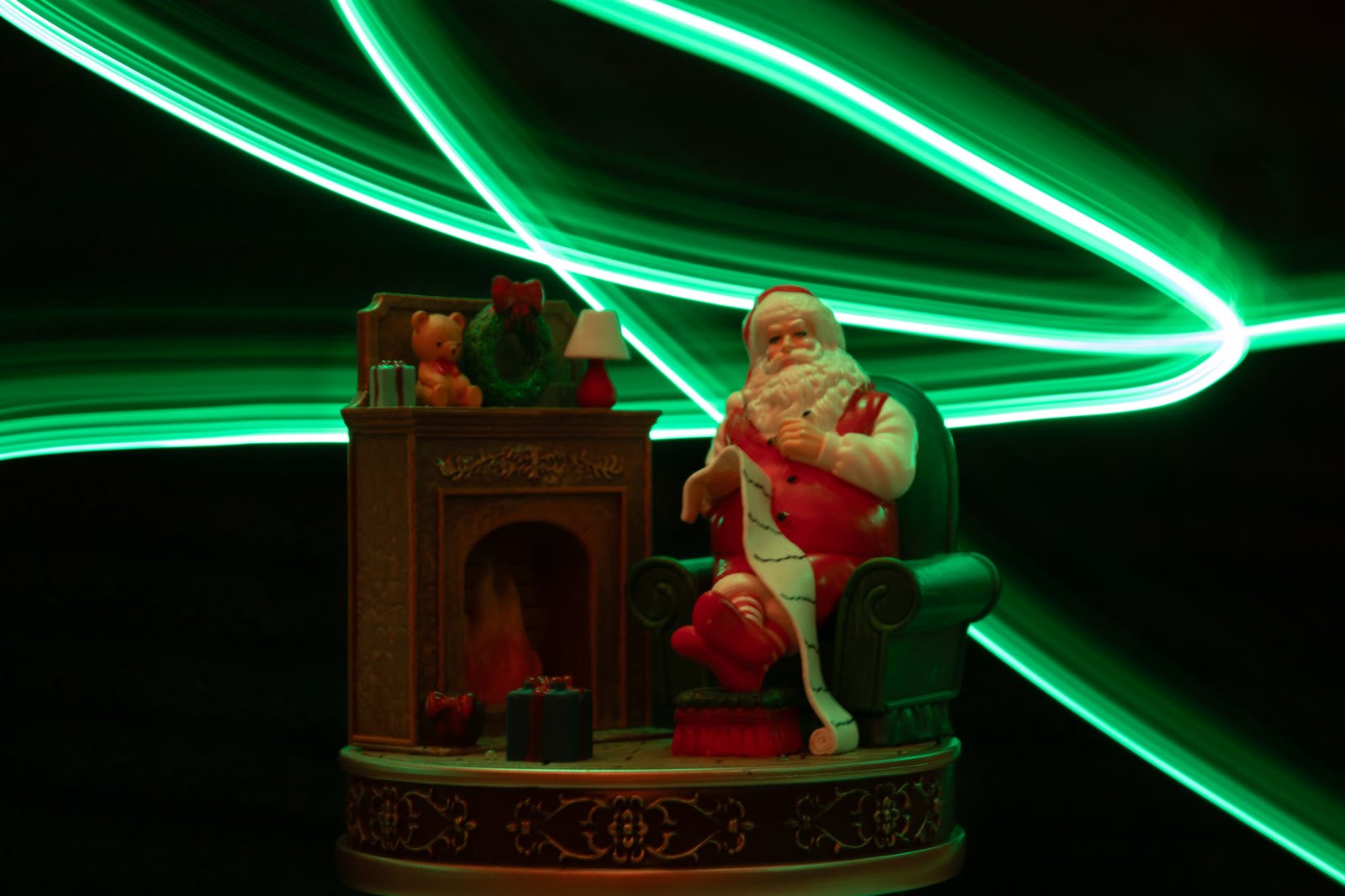 From "Christmas Lights," a long-exposure light painting around a vintage Santa figurine.