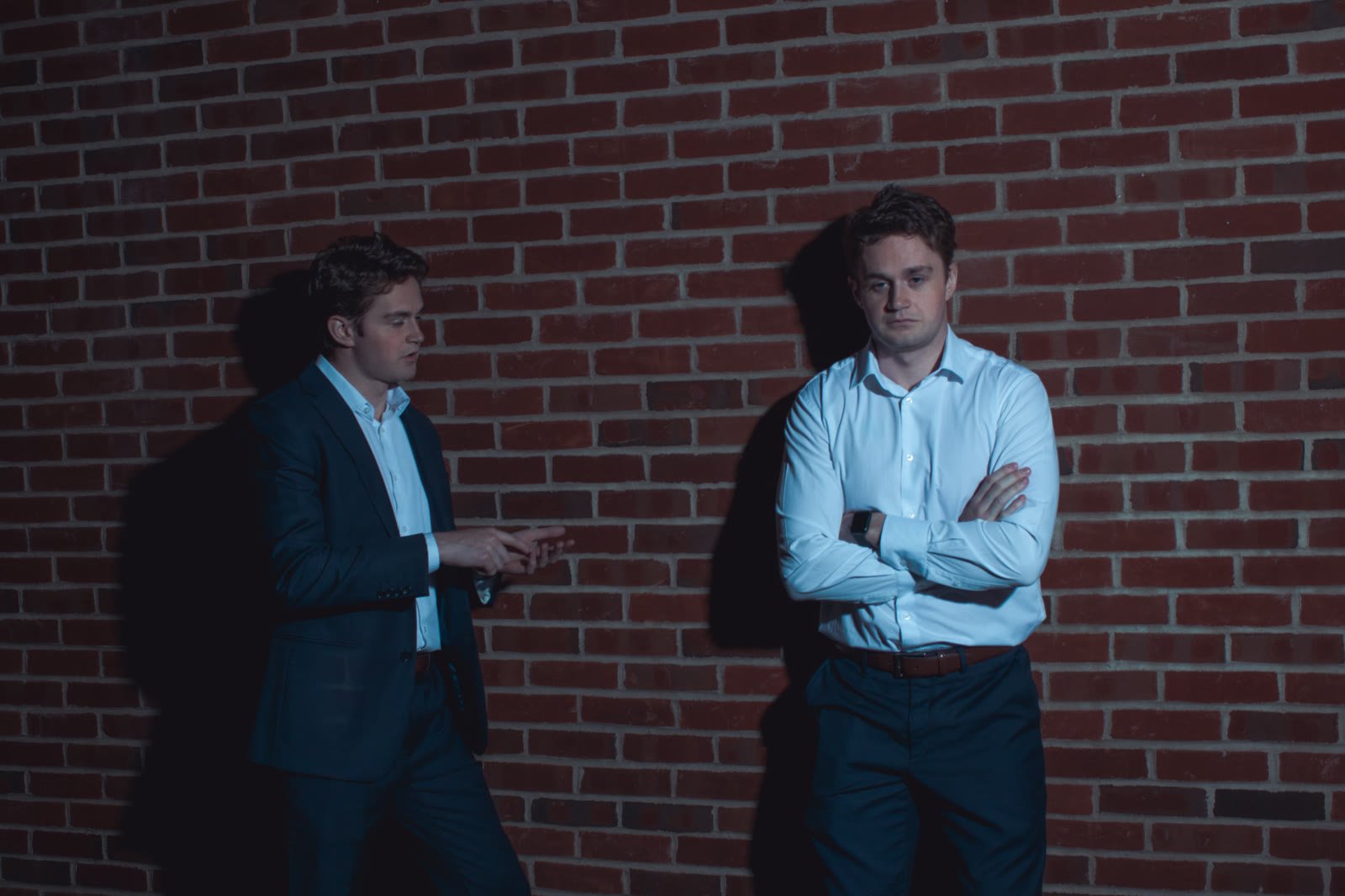 From "Self Detective," dramatic lighting against a brick backdrop.